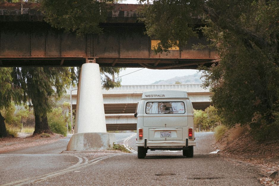 Classic camper van on a rural road trip route.